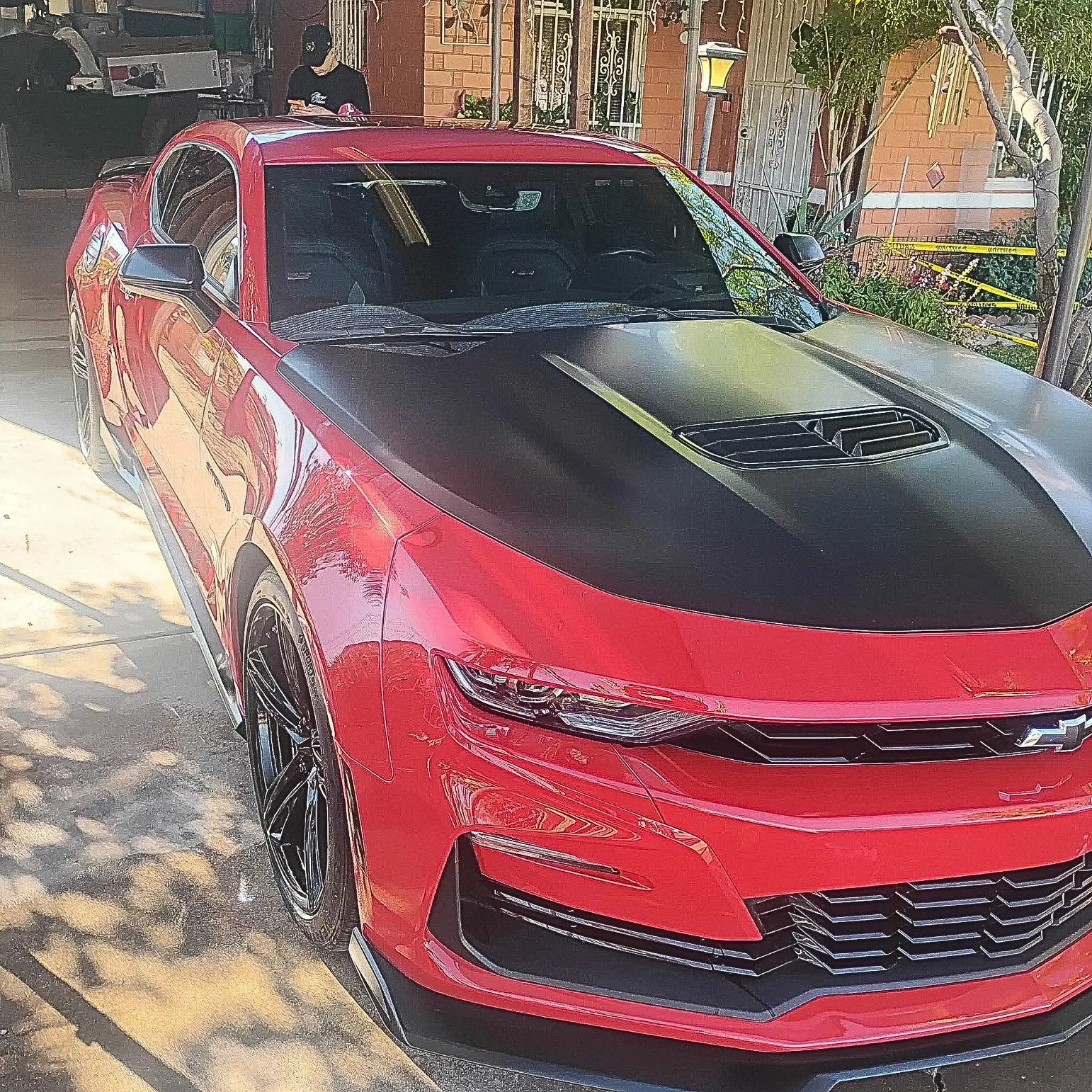 Red Camaro detailed in a Tucson driveway