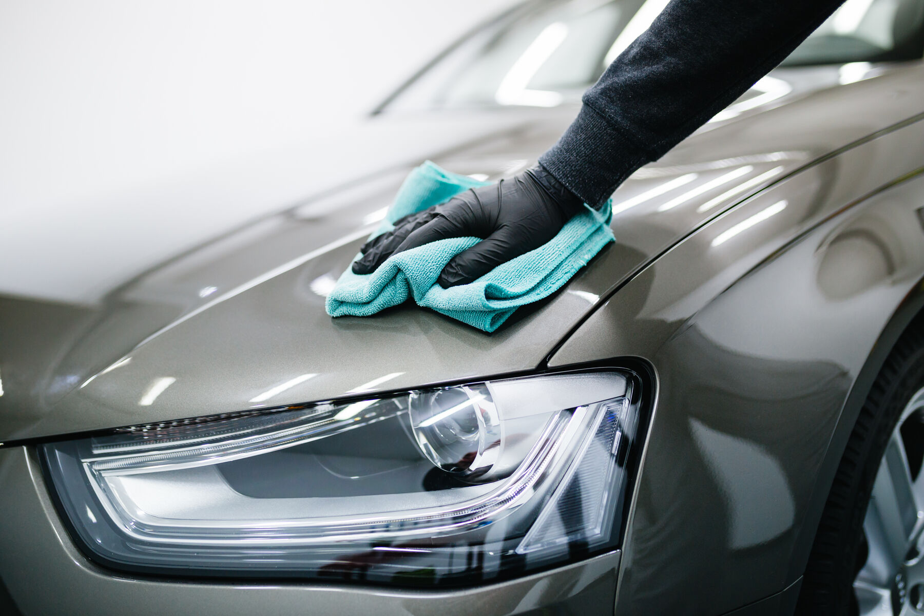 Water beading on a ceramic-coated black car